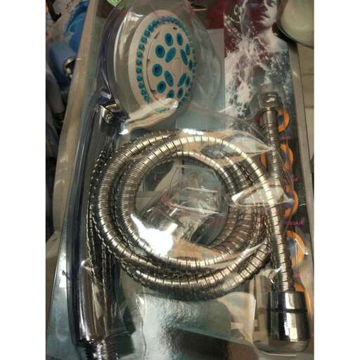 a silver bracelet with a picture of a man on it.