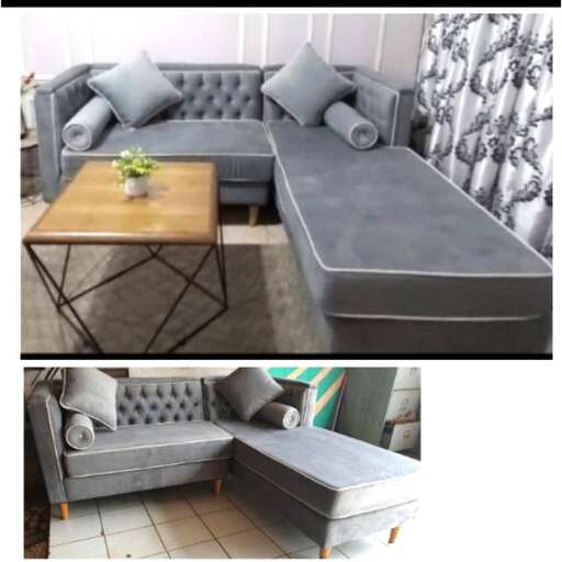 a gray sofa and ottoman in a living room.