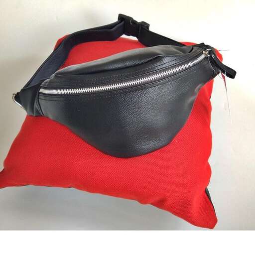 black leather tote bag with zippers and a zipper