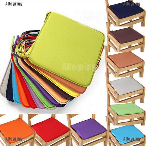 a set of colorful wooden stools with a rainbow colored top.