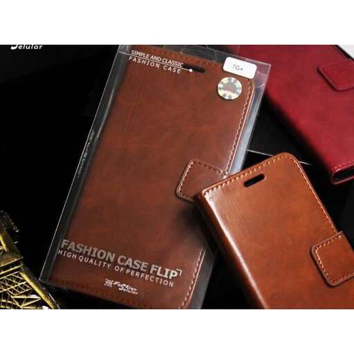 a brown leather wallet and a red wallet on a table.