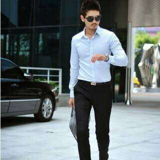 a man walking down the street with a briefcase.