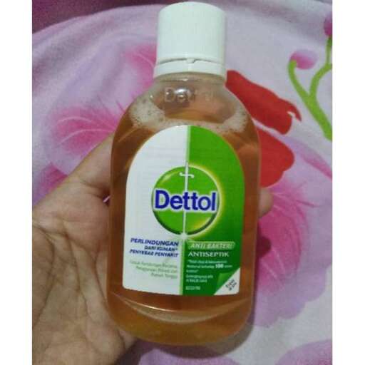a bottle of cleaner, with a white cap.