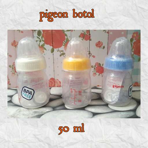 a baby bottle and two bottles of baby food.