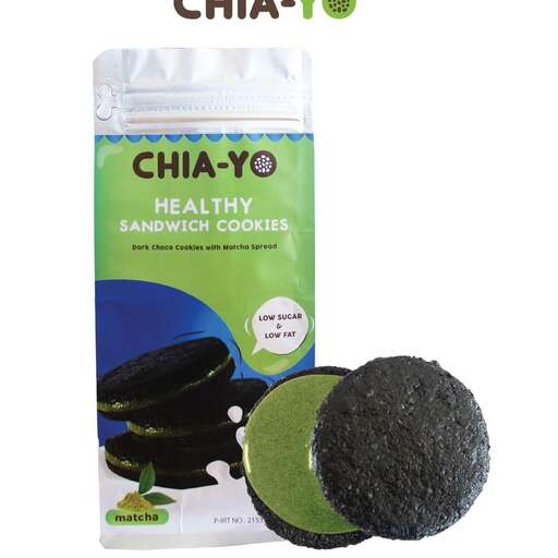a bag of black bean cookies with a green background.