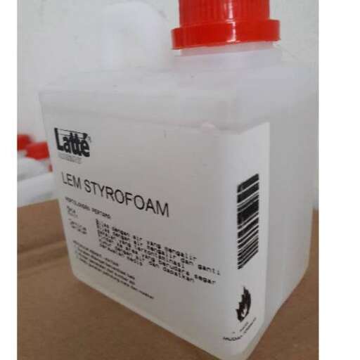 a bottle of milk with a red cap