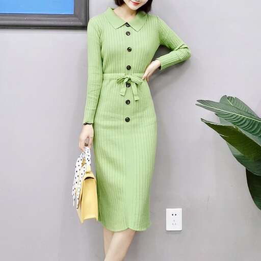 a model in a green dress and yellow purse