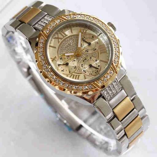a watch made of silver and gold.