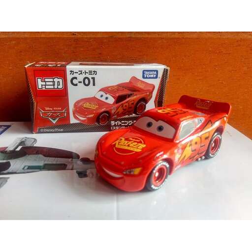 a toy car with a toy car in the back.