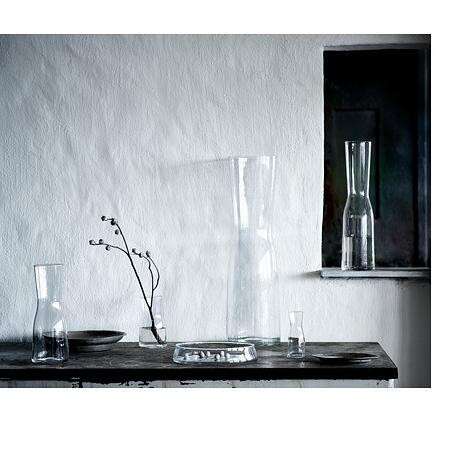 a table with vases and vases on it.