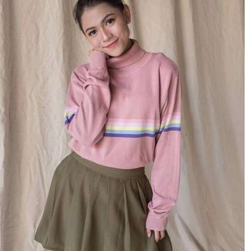 a girl in a sweater and skirt