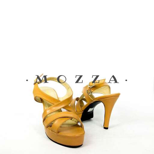 a pair of shoes with a heel and a glass of wine.