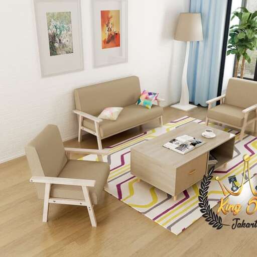 a living room with a couch, chair, table and lamp.