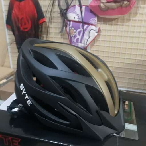 the helmet is made of gold and black.