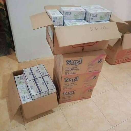 a stack of boxes sitting on top of a floor.