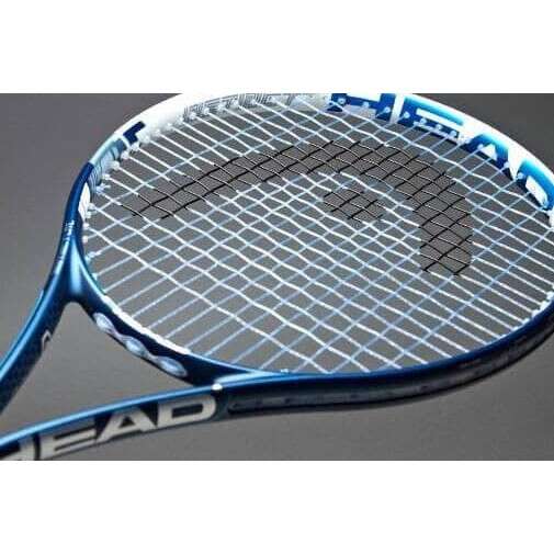 a close up of a tennis racket on a table