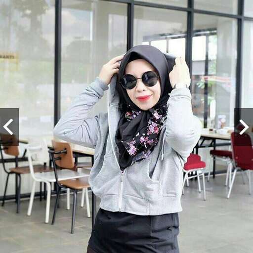 a woman in a black and white outfit