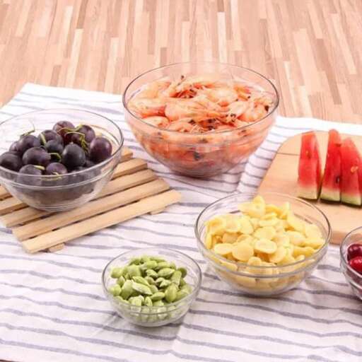 a picnic with a bowl of fruit and vegetables
