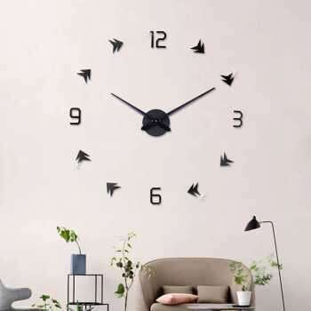 a clock on the wall with a chair and a chair.
