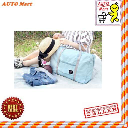 a woman laying on the ground with a bag of clothes.