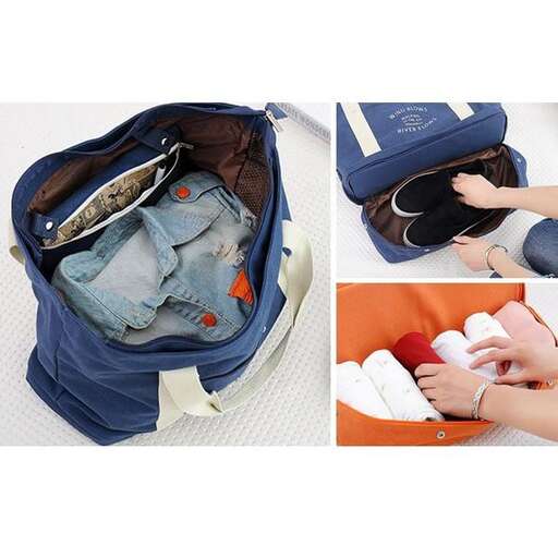 a person's hand is holding a bag with a pair of jeans.