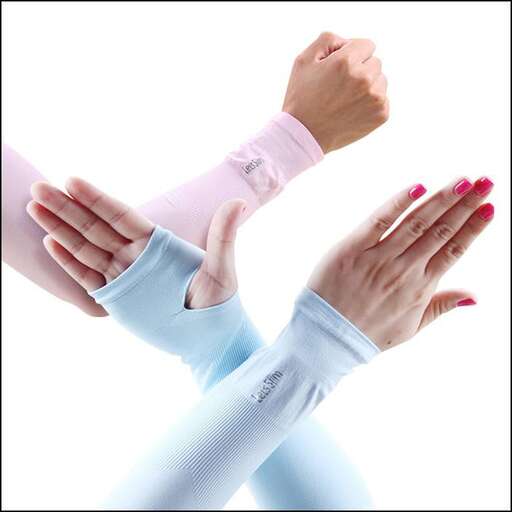 a woman with pink nail polish on her wrist.