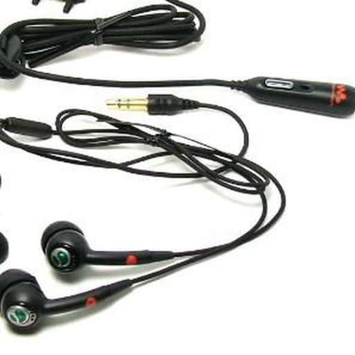a bunch of black and red ear buds.