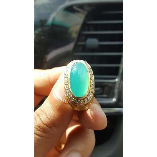 opal in sterling silver with a green stone