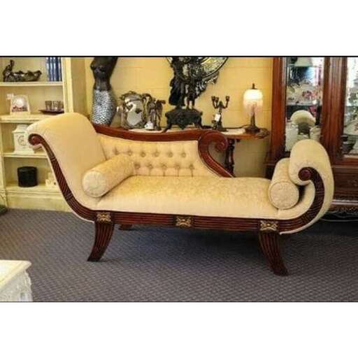 a couch with a chair on it in a room.