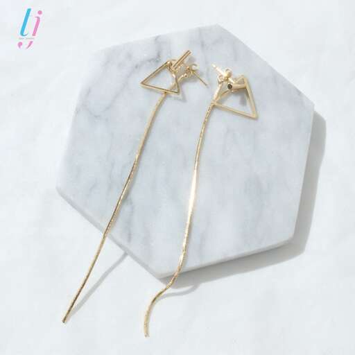 a pair of gold earrings