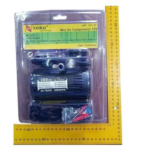 a plastic box with a ruler and a camera in it.