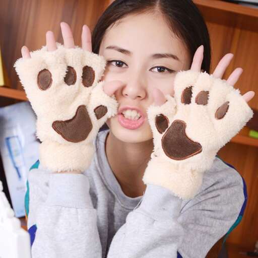 a cute little girl with a bear paw print on her hand.