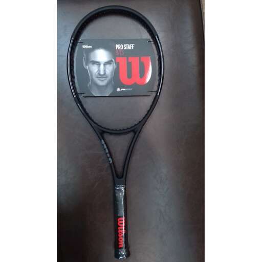 a tennis racket with a picture of a tennis player on it.