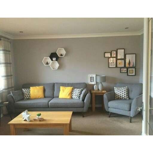 a living room with gray couches and a coffee table.