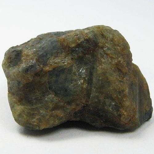 a large rock with a dark green background