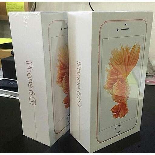 a couple of iphones are sitting on a table.