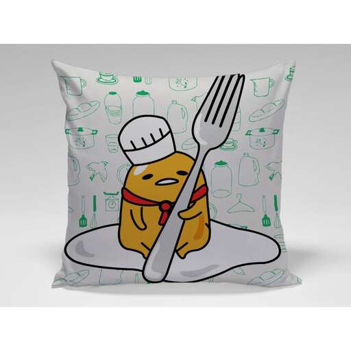 a pillow with a chef's hat and spoon.