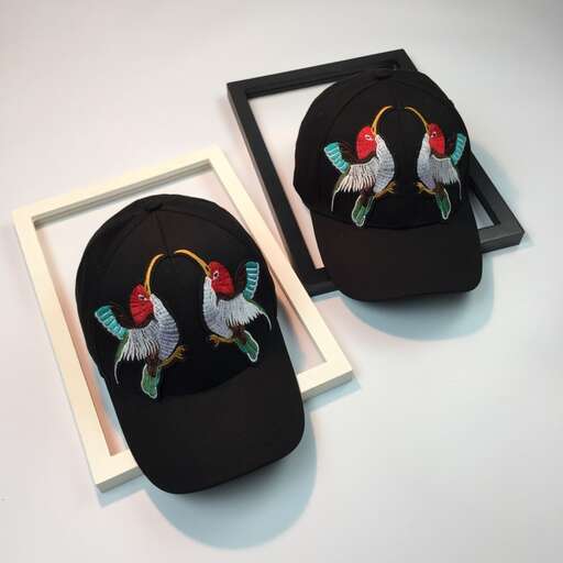 two wooden boxes with birds in a box