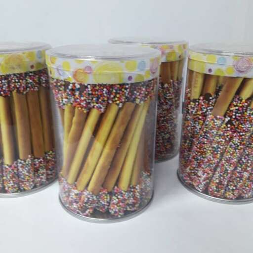 a jar of bamboo with a flower design
