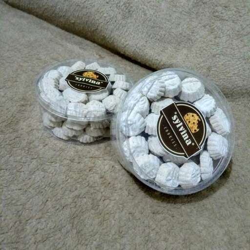 a box of white chocolates in a plastic container.