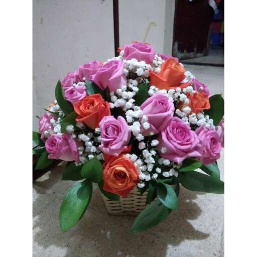 a basket of roses with a basket of flowers.