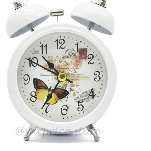 a clock with a butterfly on the face