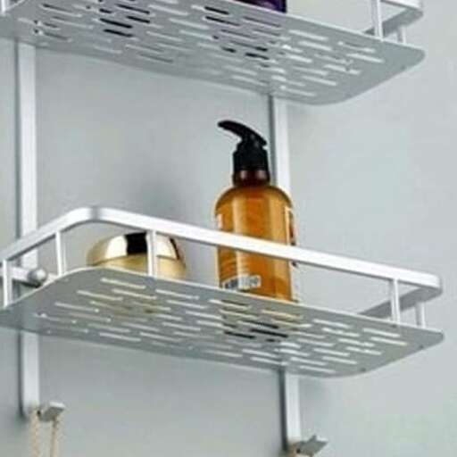 a metal shelf with a bottle of shampoo on it.