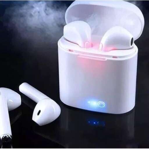 a white candle inside a white container.