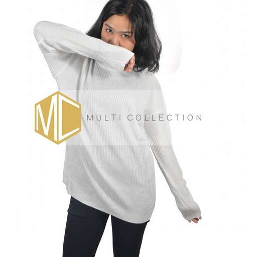 the long sleeved sweater with the sleeves rolled up.
