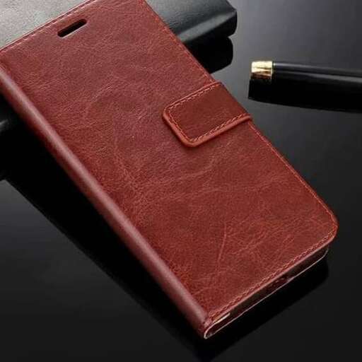 a leather notebook with a pen and pen.