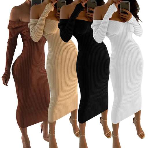 a woman in a long dress holding a cell phone.