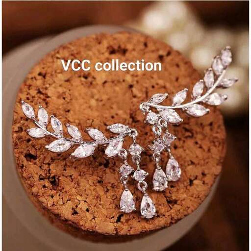 a brooch with a leaf cut out of it