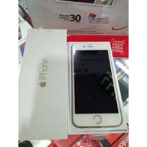 a white box with a silver iphone inside of it.