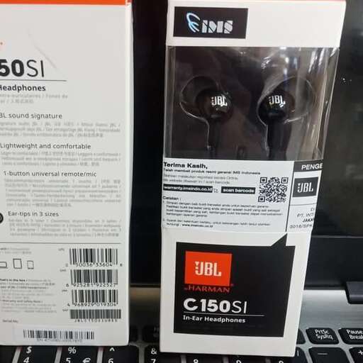 a laptop with a black cord plugged in to it.